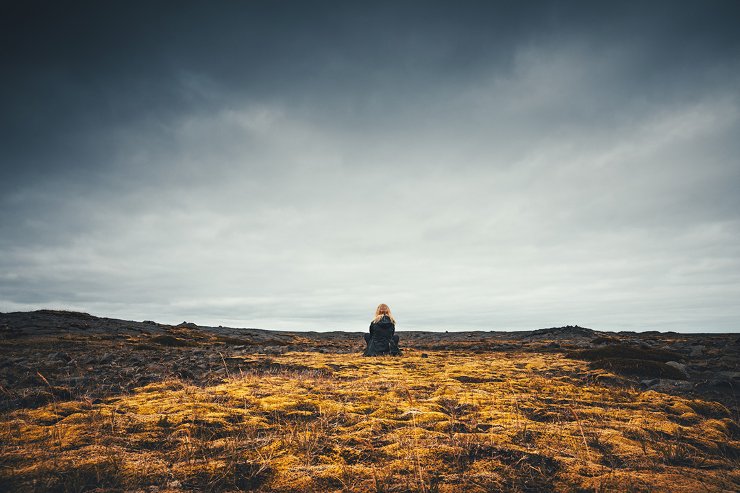 Woman sitting in field