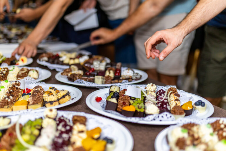 Guests select tasty desserts from many choices.